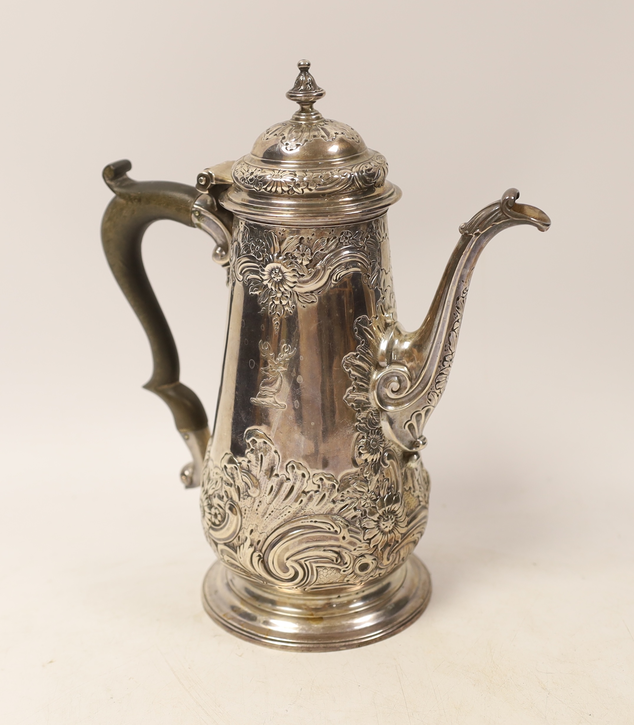 A George II silver coffee pot, with later embossed decoration, by Gurney & Cook, London, 1749m height 23.3cm, gross weight 22.2oz.